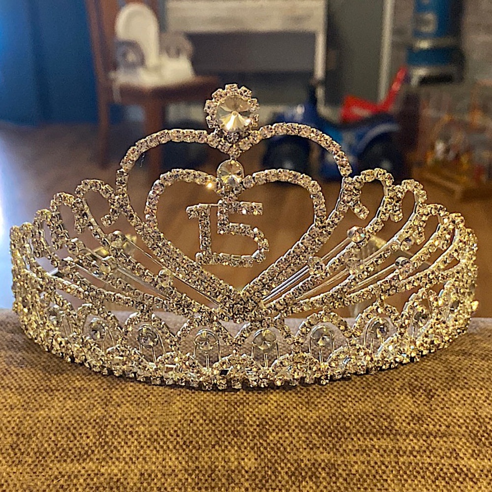 NWOT. Never worn. Beautiful tiara matches and color theme.